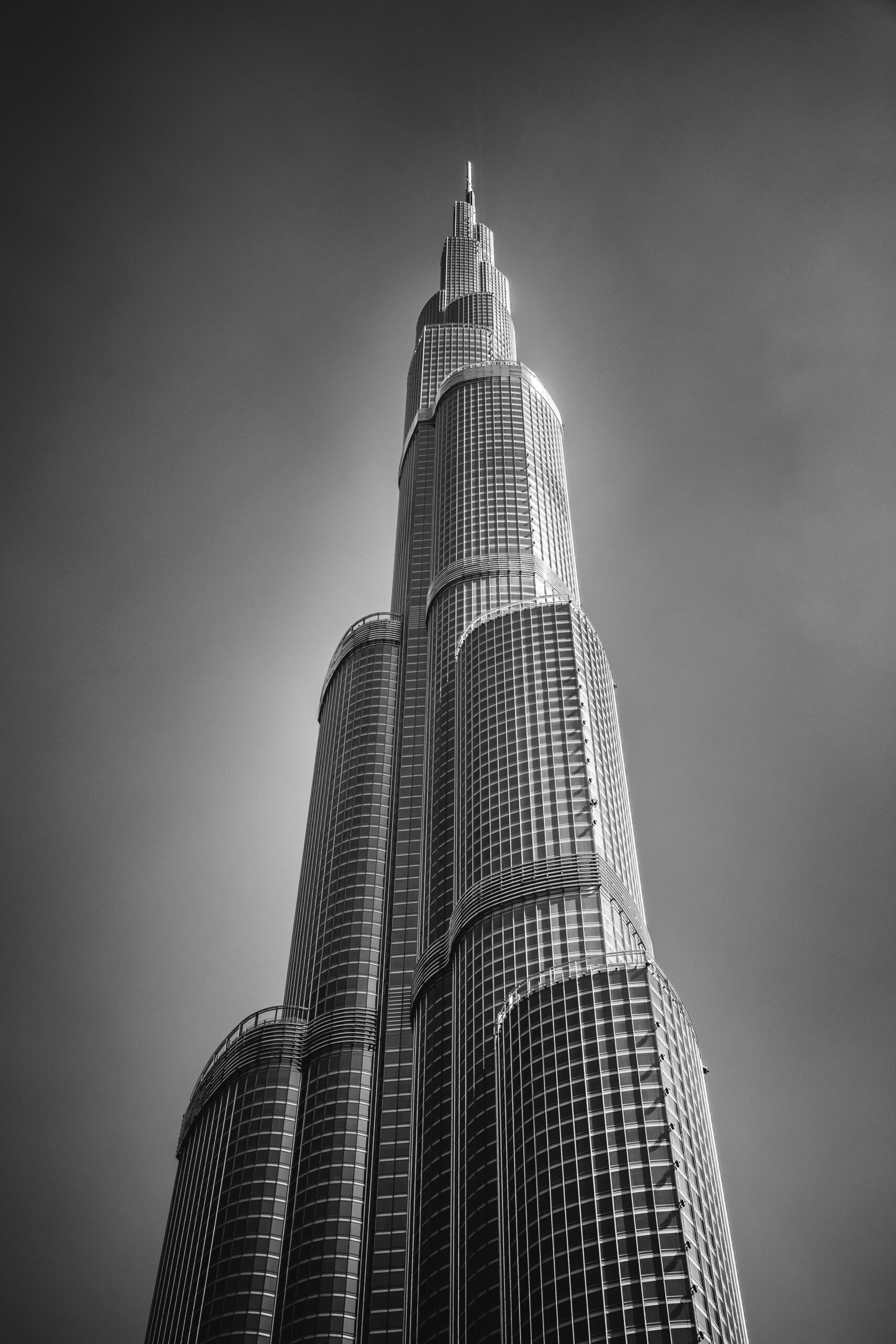 Grayscale Photo of Concrete High RiseBuilding